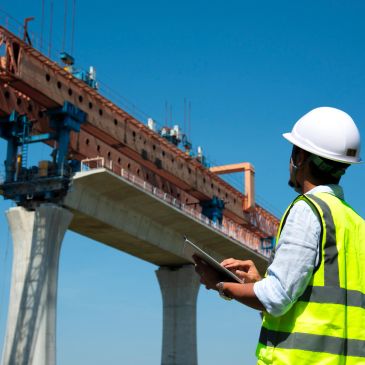 Engineer inspecting a bridge construction site.