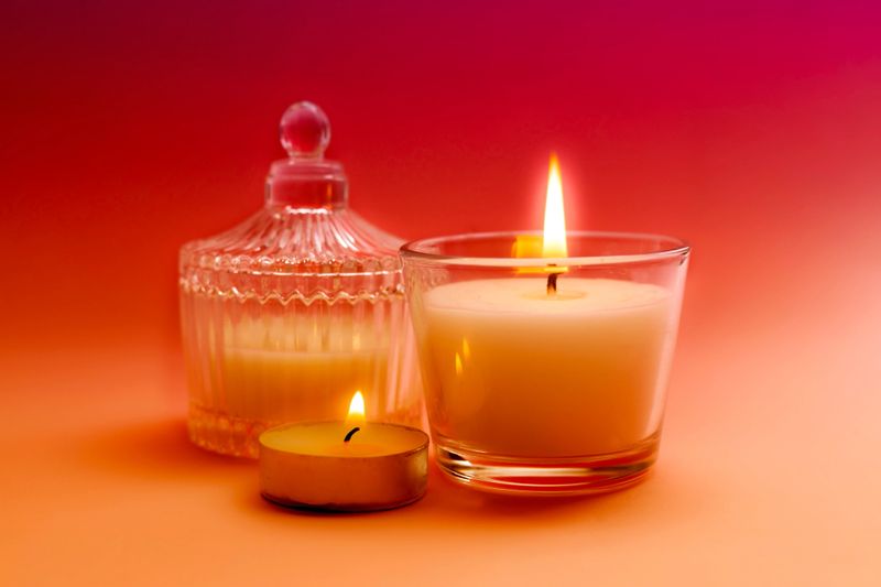 Set of aromatic caandles closeup.Beautigul burning candle, luxury object closeup. Aroma treatment.