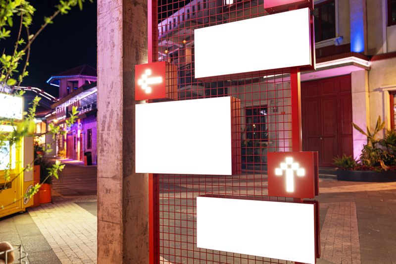 White advertising signs on the city's main shopping street at night