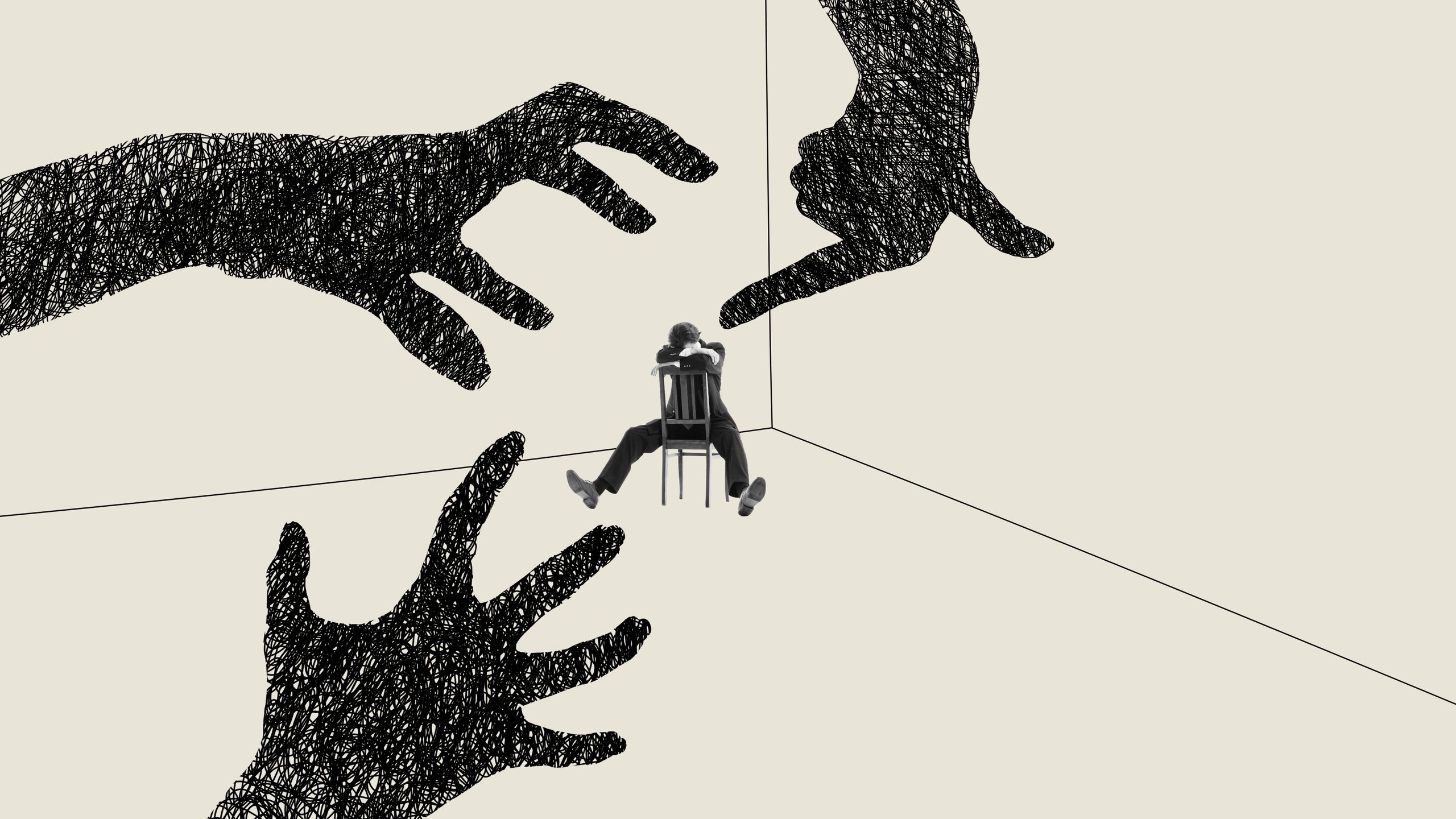 Person sitting on a chair surrounded by large shadowy hands on walls.