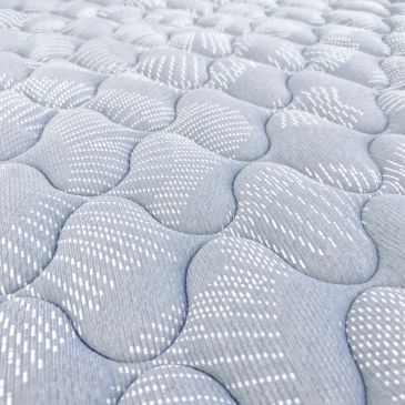 Close-up of textured mattress fabric.