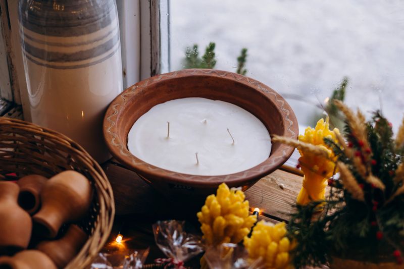 Large soy candle in a handmade clay bowl. Minimal natural home decor, cozy atmosphere, eco friendly lifestyle, slow living concept, artisanal pottery and sustainable gift idea.