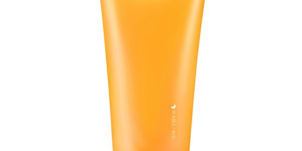 Orange cosmetic tube on a white background.