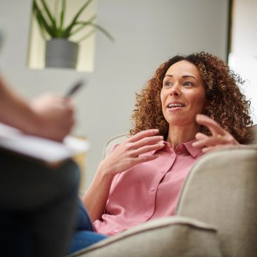 Woman expressing herself during a conversation.