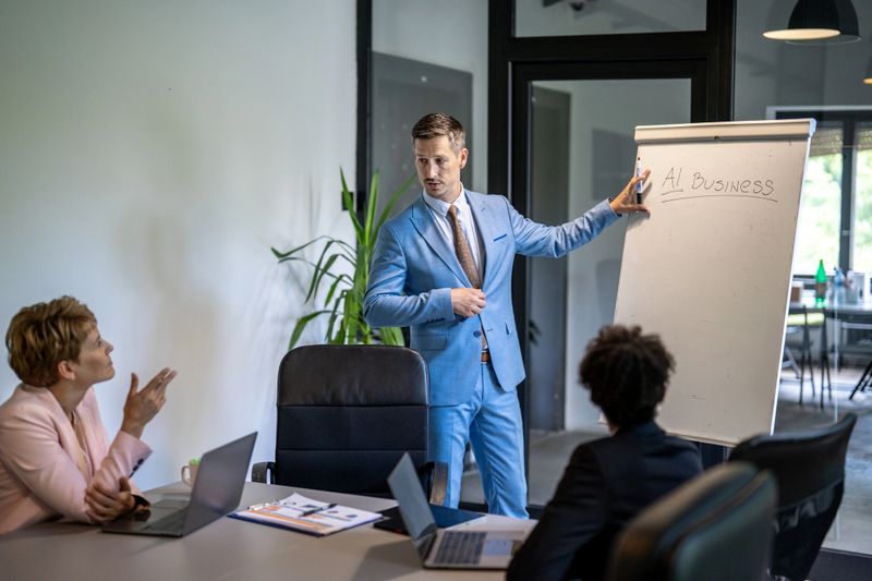 Businessman presenting ai business strategies to colleagues in a modern office, fostering collaboration and innovation
