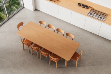 Wooden dining table with eight chairs in modern kitchen.