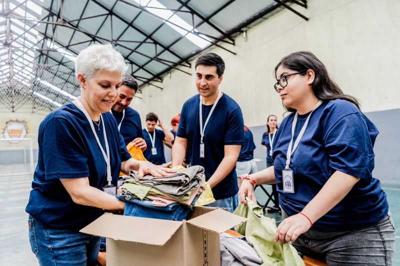 Volunteers organizing donation boxes at community center