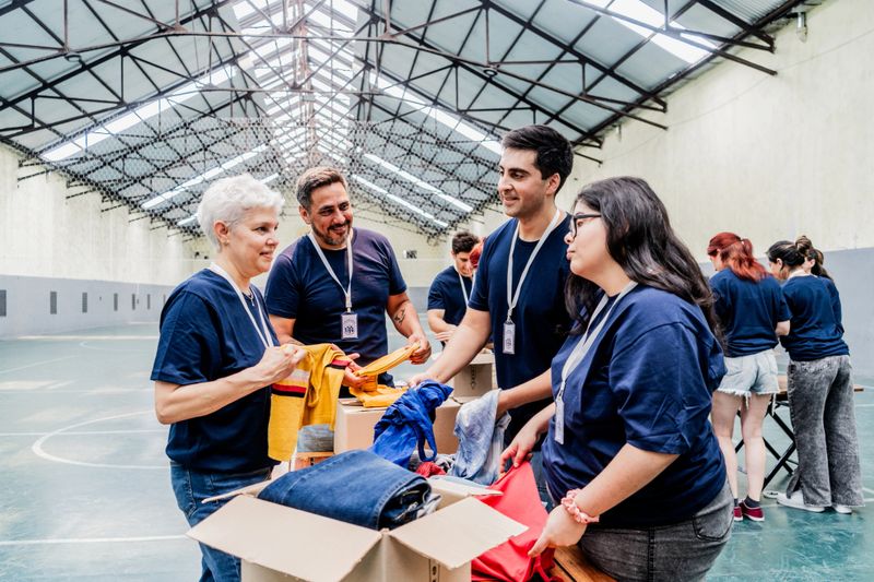 Volunteers organizing donation boxes at community center