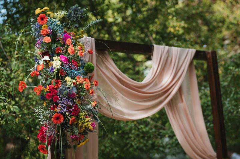 Beautiful wedding arch decorated with fresh flowers stock photo