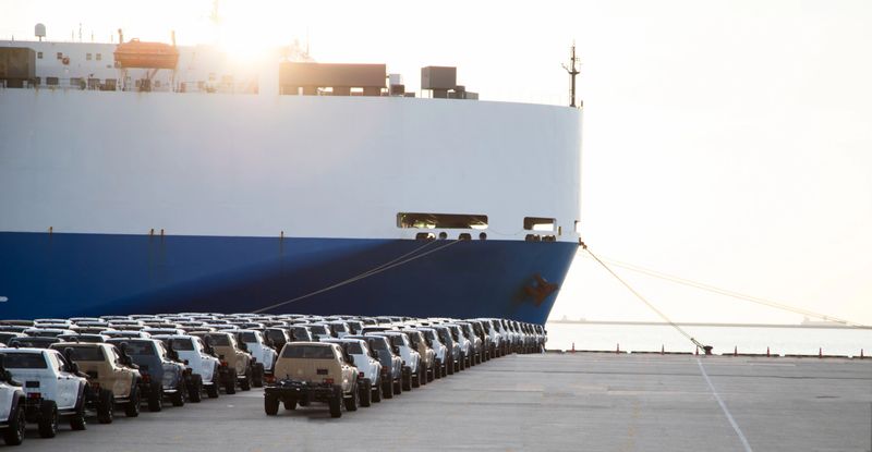 Close up vehicle carrier vessel loading car for shipping to worldwide, Large RoRo (Roll on off) vehicle car carrier, New car lined up in the port for import export around the world.