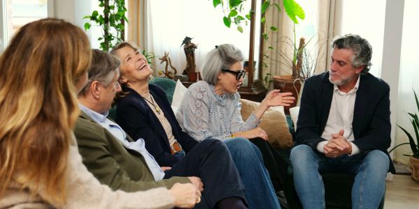 Group of people enjoying a lively conversation.