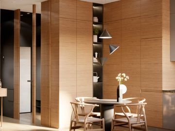 Cozy dining area with wooden walls and minimalist furniture.