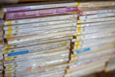 Stacked cardboard boxes wrapped in plastic.