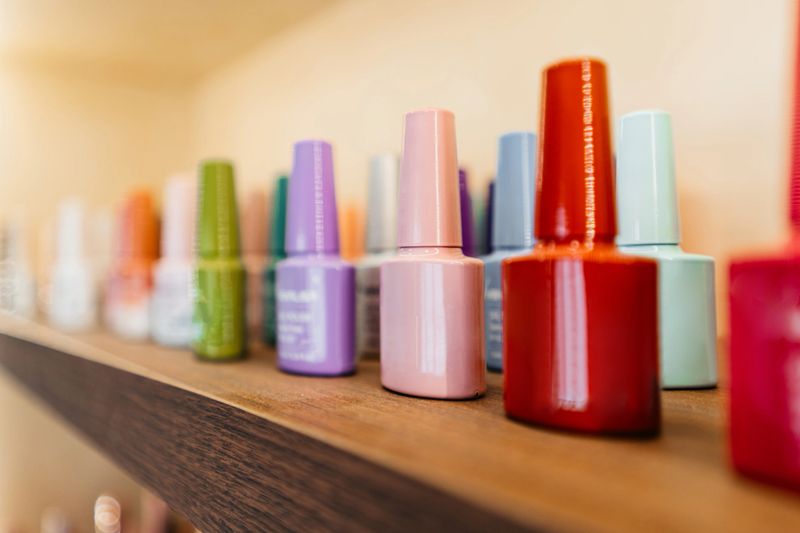 Nail polish bottles on the shelf at a beauty salon.