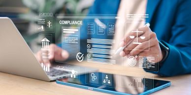 Person interacting with a digital compliance interface on a tablet.