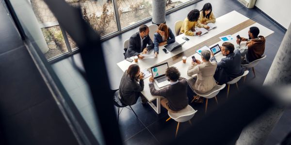 Business meeting with diverse colleagues around a table.