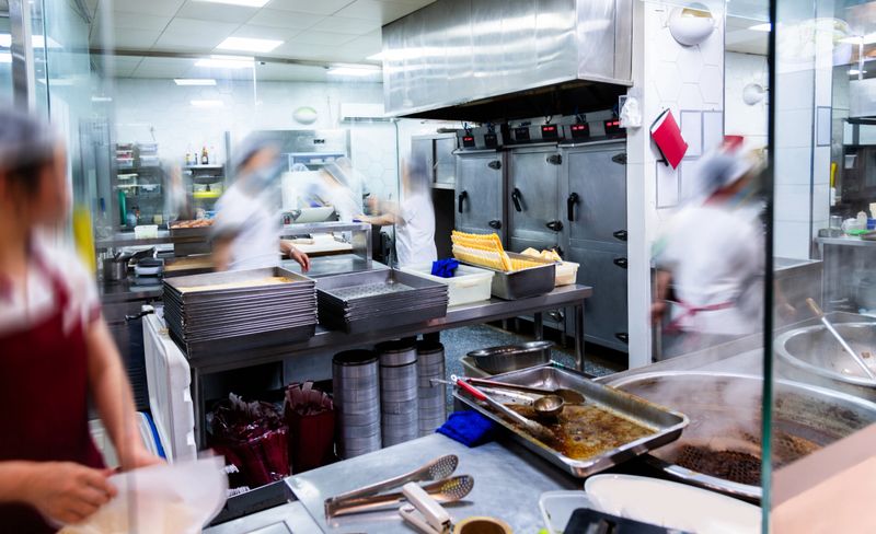 Group of chefs working in restaurant kitchen