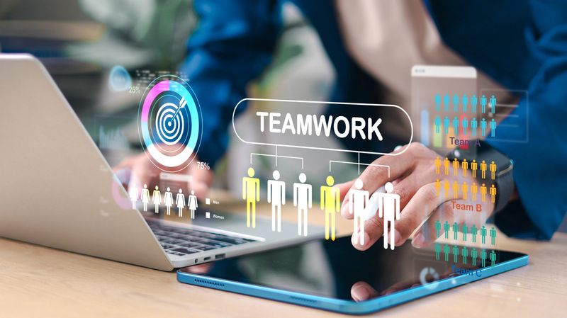 Teamwork and collaboration concept. Business team analyzing workforce data, performance metrics and organizational structure using digital technology interface.