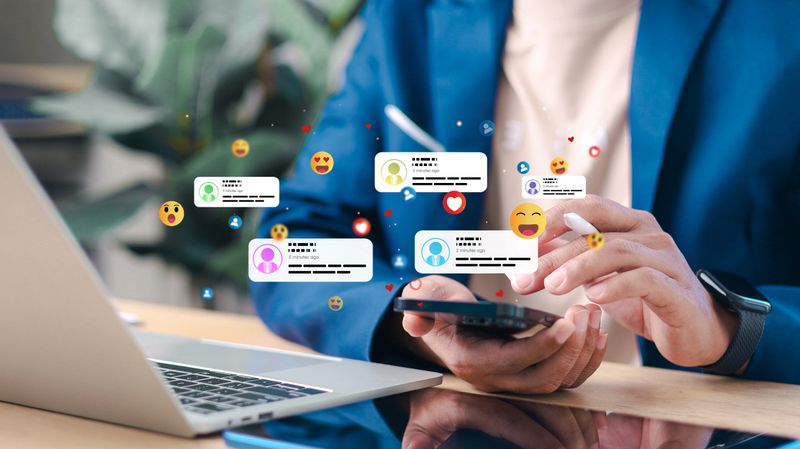 Business professional using smartphone with floating social media notifications, likes and comments. Concept of social media engagement, online communication and digital marketing.