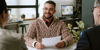 Man smiling during a job interview.