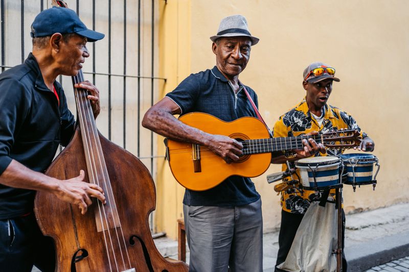 Street musicians playing Cuban music on the city street in Havana in Cuba.