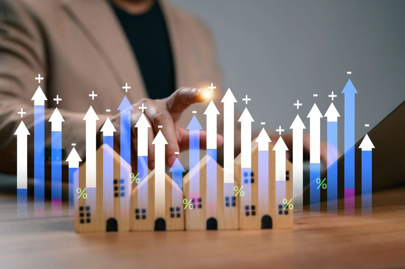 Businessman analyzing financial growth in real estate market. Concept of property investment, house mortgage interest rate trends, housing price increase, and professional home financial management.