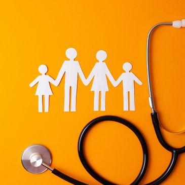 Paper cutout family with stethoscope on orange background.