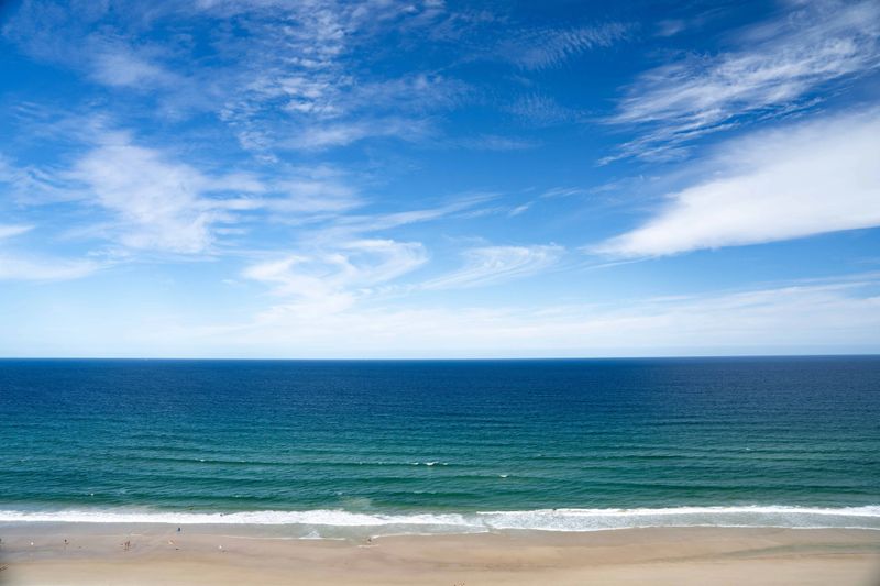 A holiday view of an apartment overlooking a beach