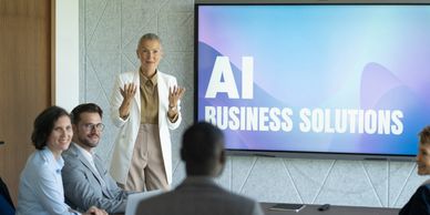 Business meeting discussing AI solutions.