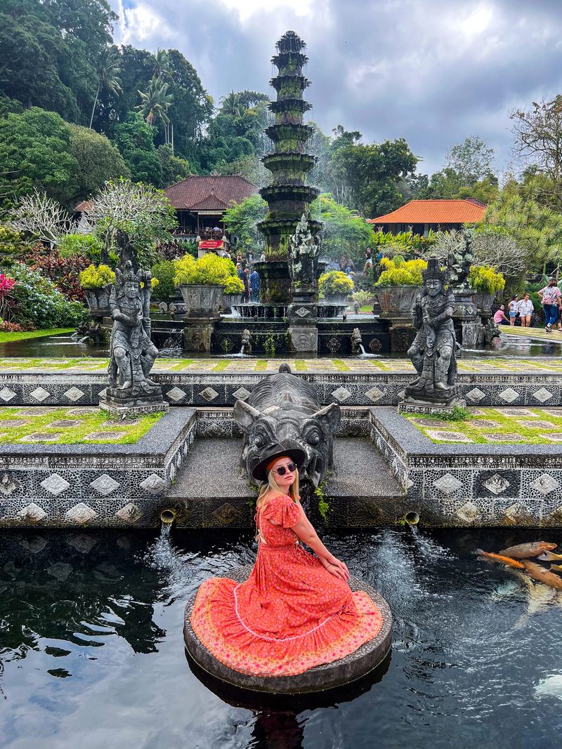 Tirta Gangga in Bali, Indonesia. Meditating on a lone stone in the water