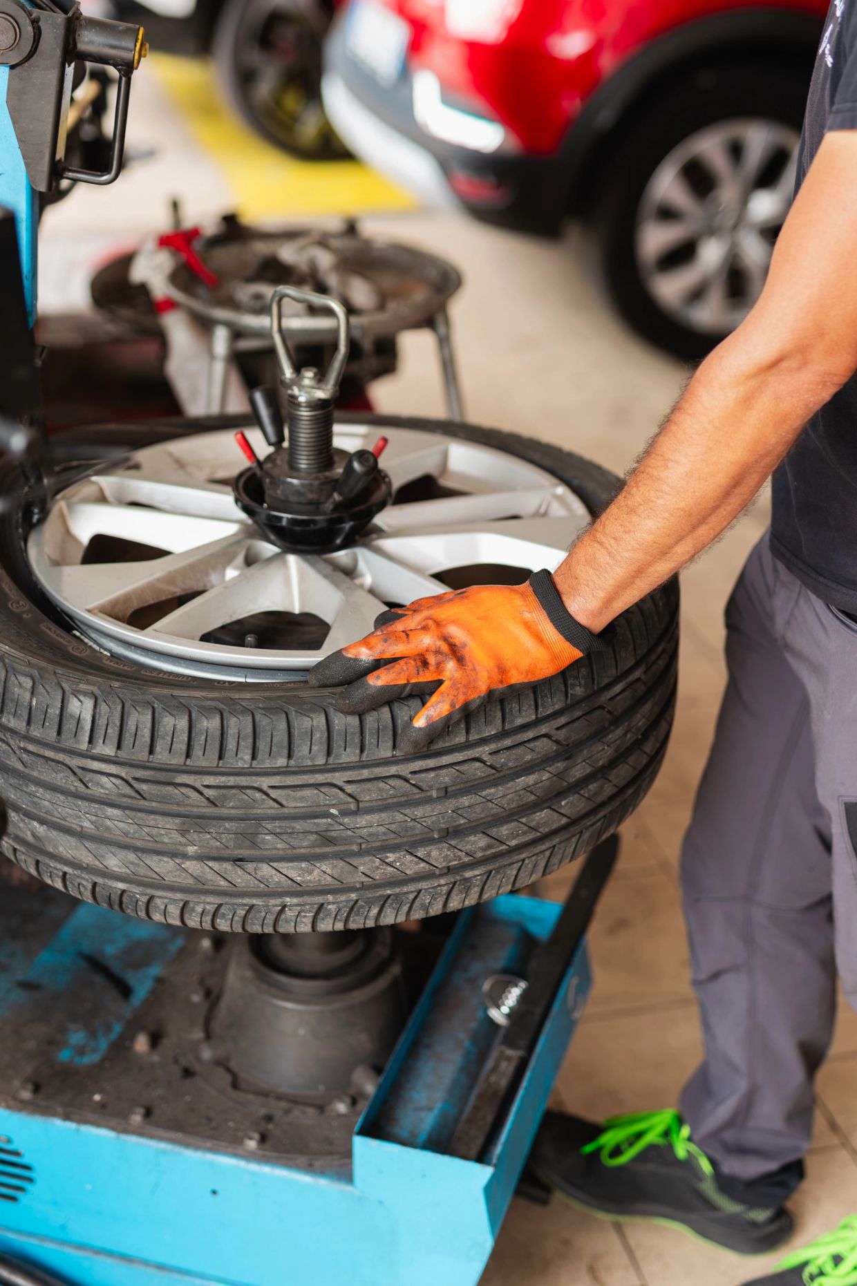 Car tire with alignment tool at Fort Myers workshop.