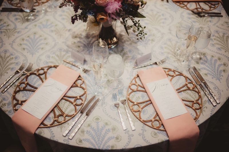 Wedding reception table with flower centerpiece and menu