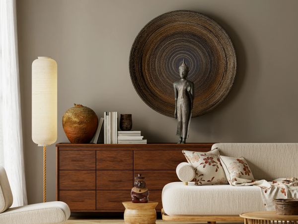 Cozy living room with earthy tones and Asian-inspired decor.