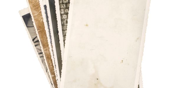 Stack of old blank photographs.