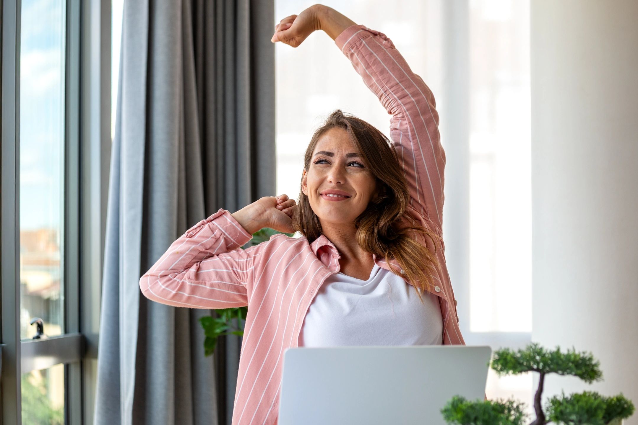 Woman stretching with a smile.