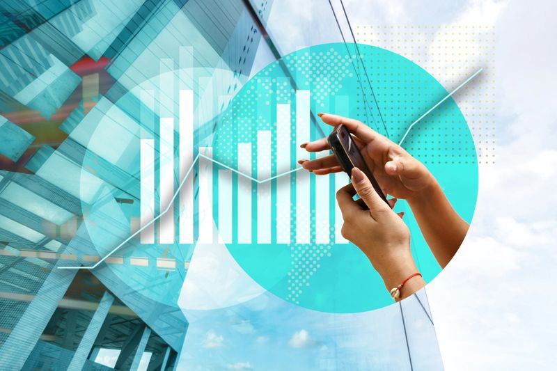 abstract collage of hands holding mobile phone on vibrant business background