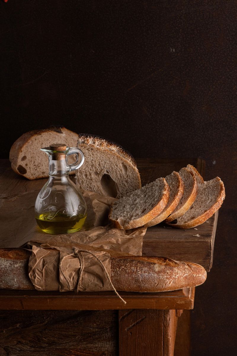 Freshly Baked Sourdough Bread Sliced on a Wooden Cutting Board
