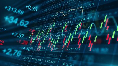 Digital stock market data with candlestick charts and numbers.