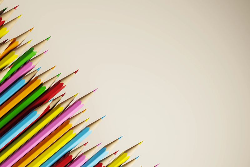 Diagonally aligned colorful pencils on a clean light background, 3D Rendering, representing a creative concept with copyspace for modern design