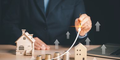 Businessman showing growth in real estate investment.