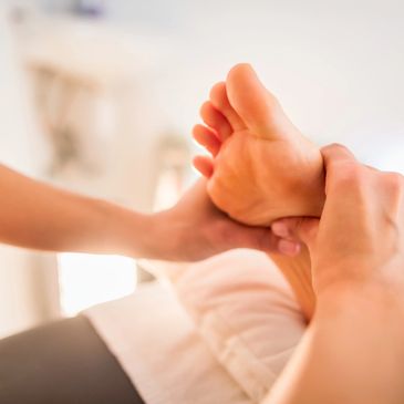 Close-up of a foot massage in progress.
