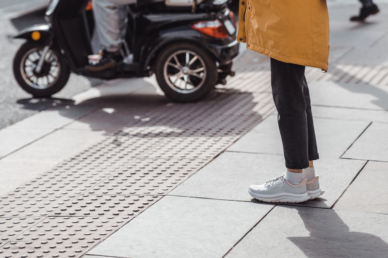 Woman wearing white sneekers, close-up view
