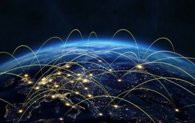 Global network connections over Earth at night.