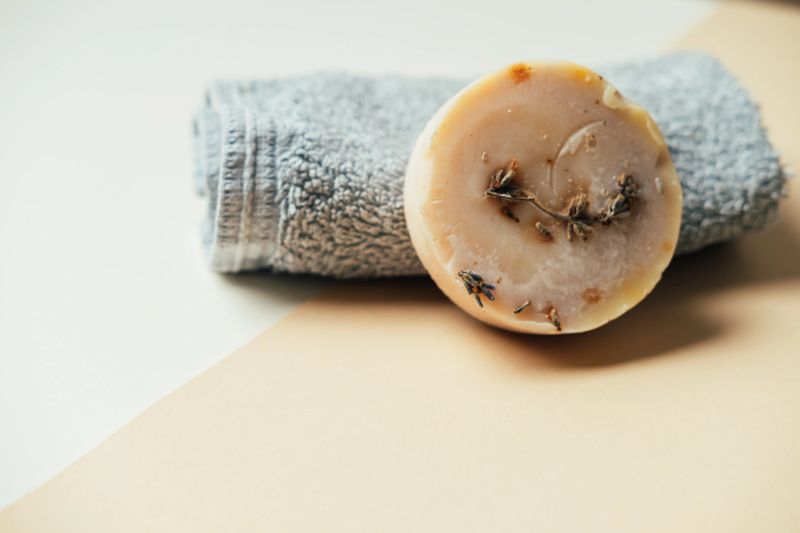 Handmade Lavender Soap On Towel, Staged For Artisan Apothecary Product Shot, Round Soap Studded