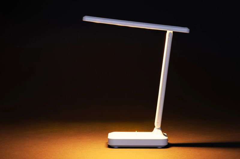 Modern LED table lamp lighting in dark.