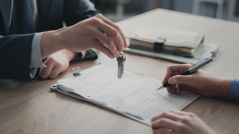 Signing the document and receiving the keys
