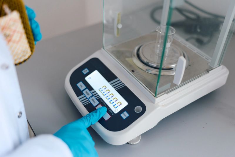 Precision weighing scales used in a professional laboratory setting.