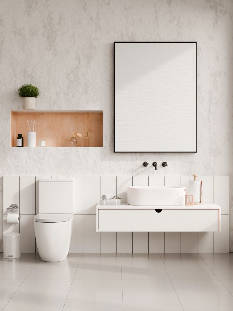 Blank poster frame mockup in modern minimalist bathroom interior with floating vanity, toilet and white ceramic sink- 3D rendering