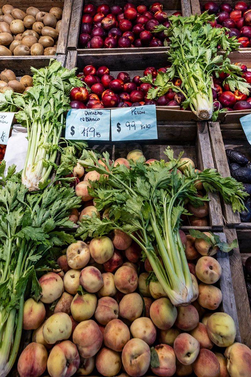 Fruits and vegetables displayed for sale at the Montevideo Agricultural Market, Uruguay. (Product names in Spanish.)