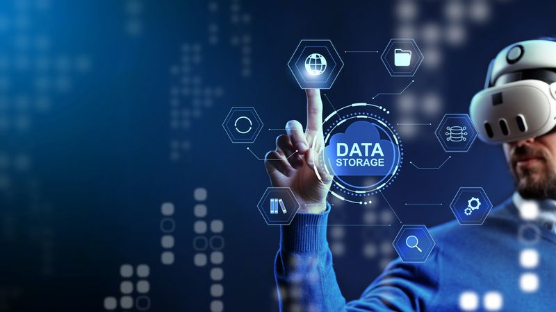 Person interacts with data storage icons in a virtual reality setting at night.